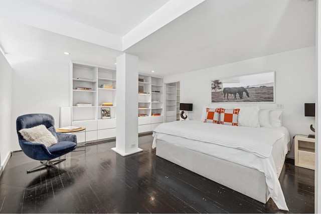 bedroom with recessed lighting and wood finished floors