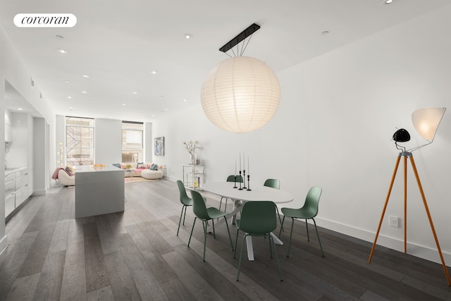 dining area featuring recessed lighting, wood finished floors, and baseboards