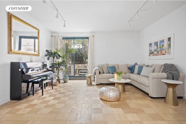 living room with rail lighting and visible vents