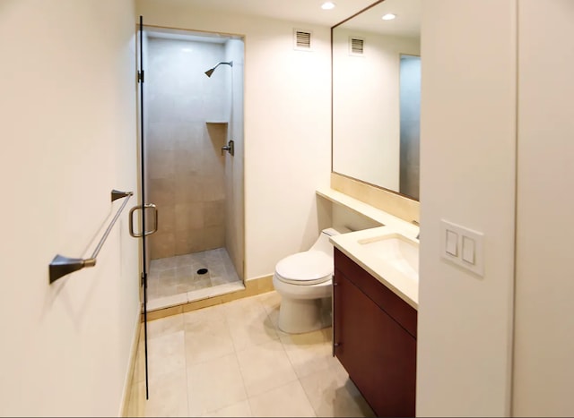 full bath featuring vanity, tile patterned floors, visible vents, and a stall shower