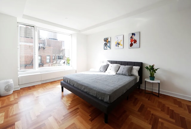 bedroom with a raised ceiling