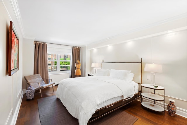 305 E 24th St Unit 5F, New York City, NY 10010 - bedroom featuring ornamental molding, wood finished floors, and baseboards