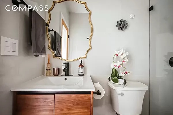 bathroom with vanity and toilet