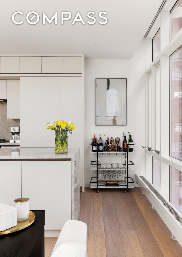 5 Beekman St Unit 21B, New York City, NY 10038 - interior space with wood finished floors, white cabinets, and light countertops