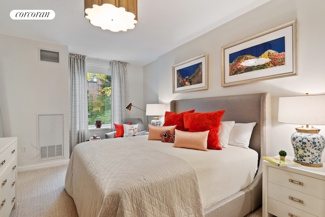 bedroom with light carpet and visible vents