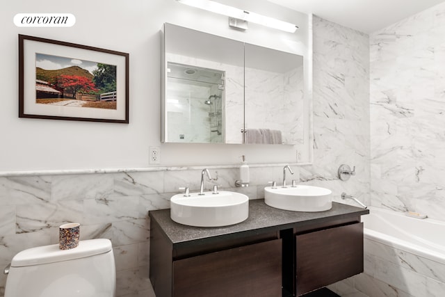 462 W 58th St Unit 1A, New York City, NY 10019 - full bathroom with tile walls, a bath, a shower, and a sink