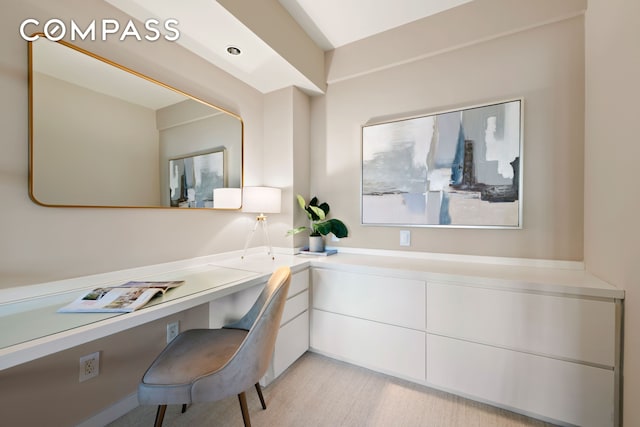 office featuring light wood-style flooring and built in desk