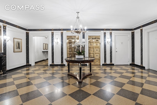 interior space with an inviting chandelier, crown molding, and decorative columns
