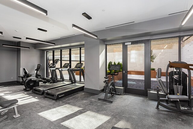 exercise room with baseboards