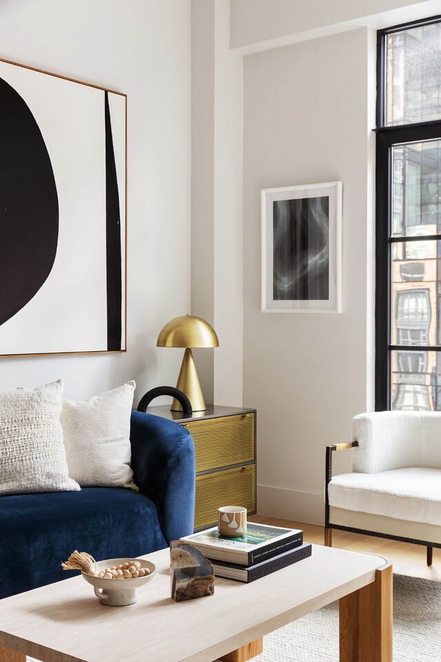 living room featuring wood finished floors and baseboards