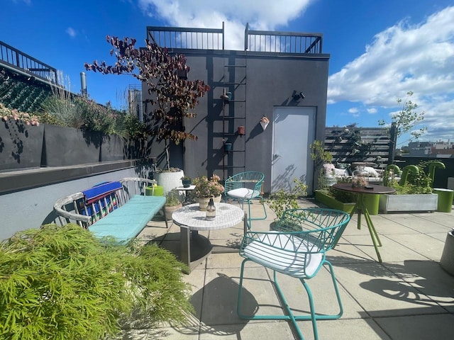 view of patio featuring fence