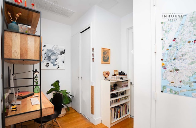 interior space featuring wood finished floors and visible vents