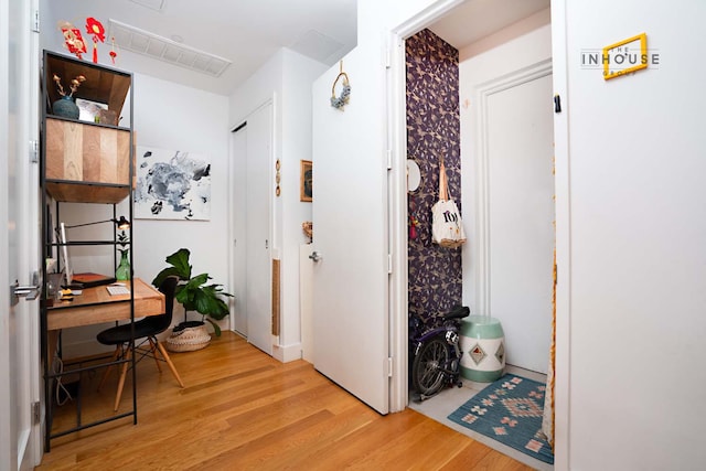 interior space featuring visible vents and wood finished floors