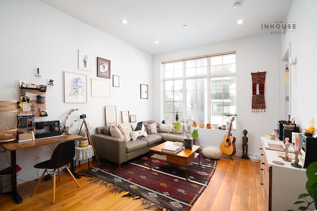 living room with recessed lighting and wood finished floors