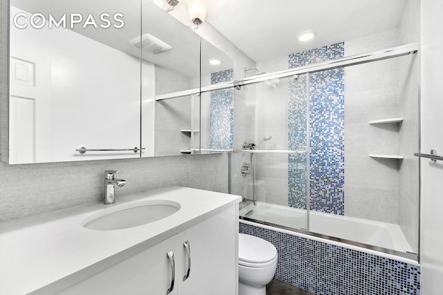 255 W 95th St Unit 1B, New York City, NY 10025 - full bathroom featuring tiled shower / bath, toilet, vanity, and recessed lighting