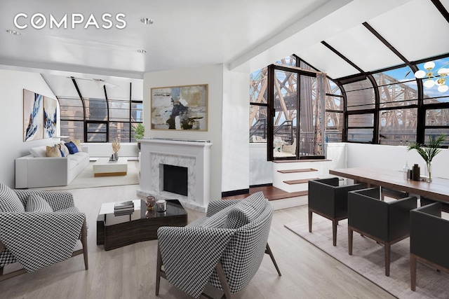 40 Sutton Pl Phm, New York City, NY 10022 - living area with wood finished floors, vaulted ceiling, and a sunroom