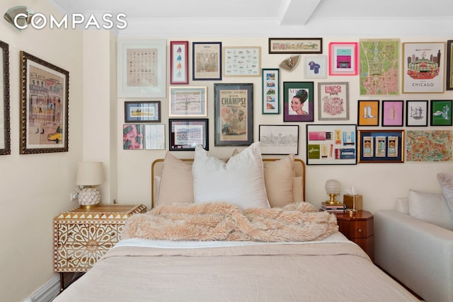 bedroom featuring beam ceiling