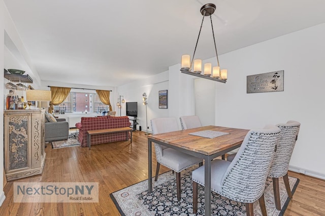 dining space featuring wood finished floors