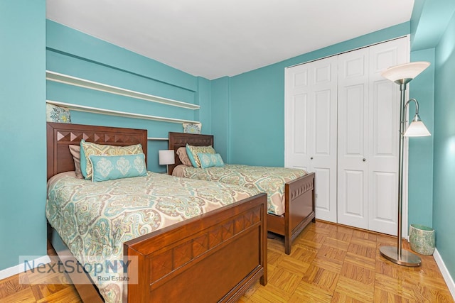bedroom with a closet and baseboards