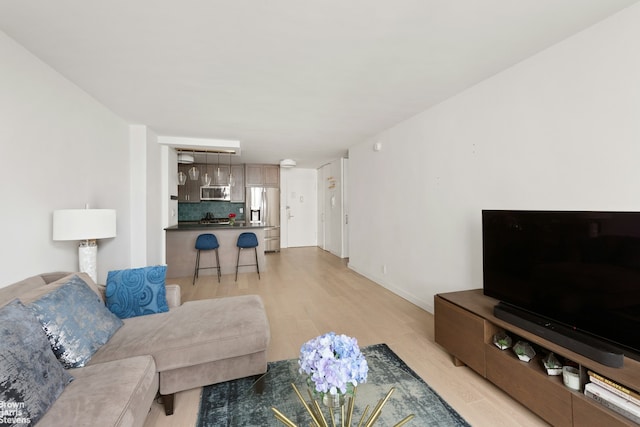 living room featuring light wood-style floors