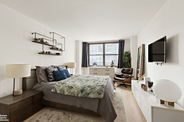 bedroom with light wood-type flooring