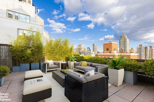 view of patio with a city view and an outdoor living space