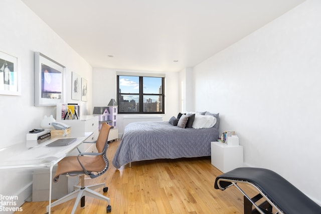 bedroom featuring light wood-style flooring