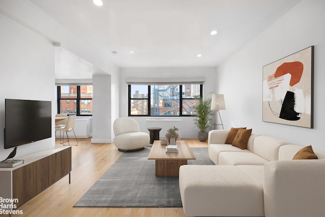 living room featuring recessed lighting and light wood-style flooring