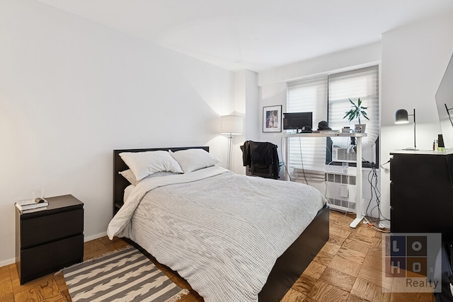 bedroom featuring baseboards and radiator heating unit