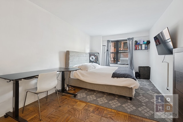 bedroom featuring baseboards