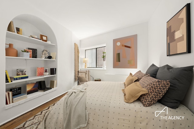 bedroom featuring wood finished floors