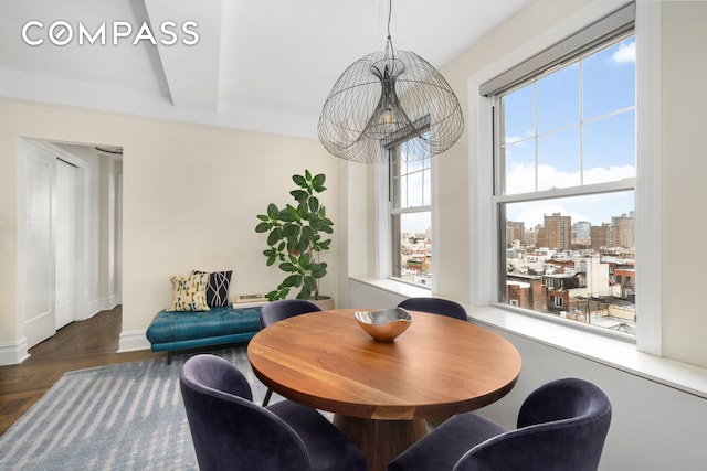 dining area featuring a view of city