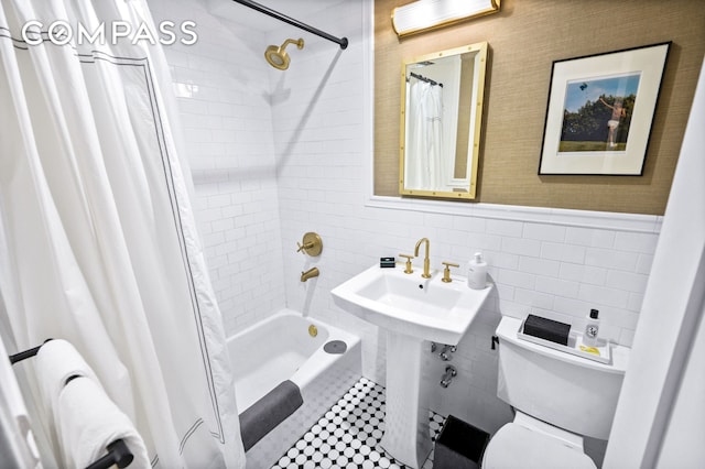 full bath with radiator heating unit, shower / bath combination with curtain, wainscoting, tile walls, and toilet