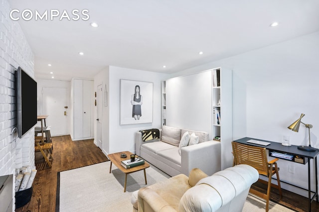 living room with recessed lighting and wood finished floors