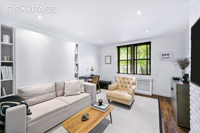 living area featuring recessed lighting, visible vents, baseboards, and dark wood finished floors