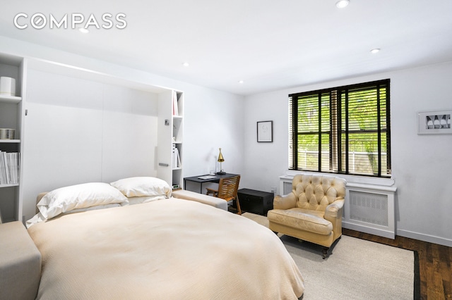 bedroom featuring recessed lighting, baseboards, and wood finished floors