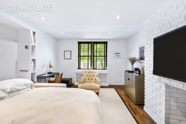 bedroom with dark wood-type flooring and recessed lighting