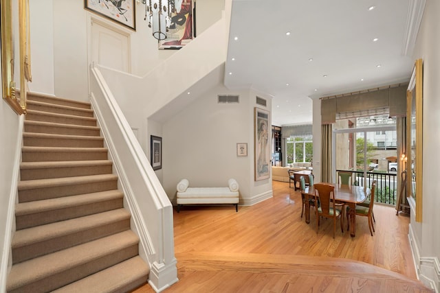 dining room with stairway, recessed lighting, visible vents, and light wood finished floors