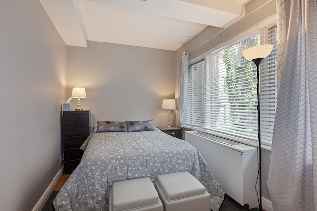 bedroom featuring baseboards