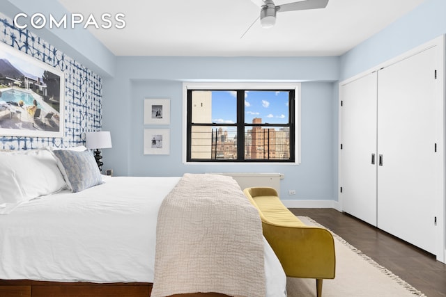 bedroom with baseboards, a closet, and ceiling fan