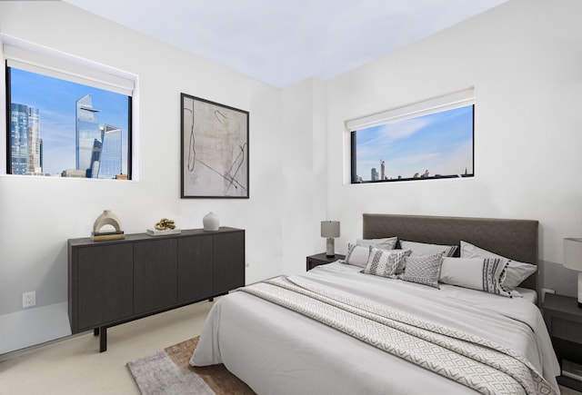 bedroom with light colored carpet