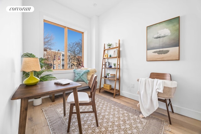 office space with wood finished floors and baseboards