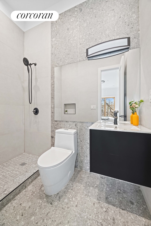 1198 Jefferson Ave Unit C, New York City, NY 11221 - full bath featuring tile walls, a tile shower, vanity, toilet, and granite tiled floors