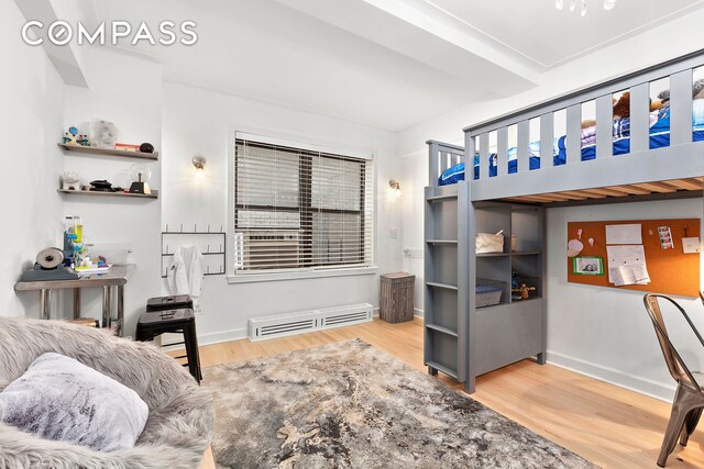 227 E 57th St Unit 8Efg, New York City, NY 10022 - bedroom featuring wood finished floors and baseboards