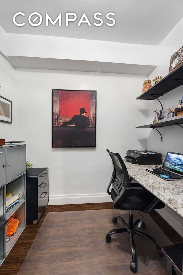 home office with baseboards and dark wood-type flooring