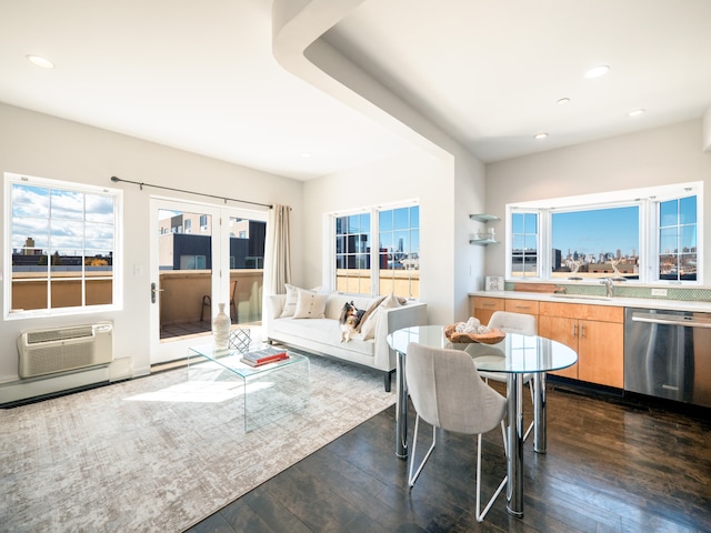 dining area with recessed lighting, dark wood-style flooring, and a wall unit AC