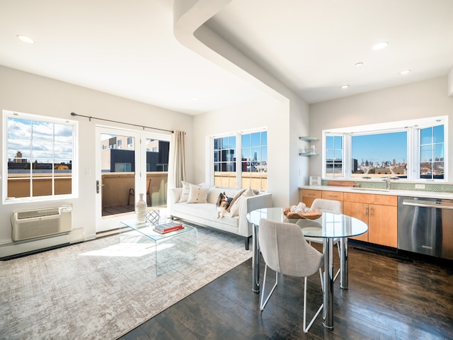 32-86 41st St Unit 5C, New York City, NY 11103 - dining area featuring recessed lighting, an AC wall unit, dark wood-style flooring, and a wealth of natural light