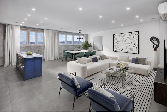 living room with recessed lighting and a wall unit AC