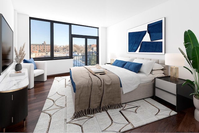 bedroom featuring a view of city and wood finished floors