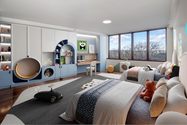 bedroom with wood finished floors